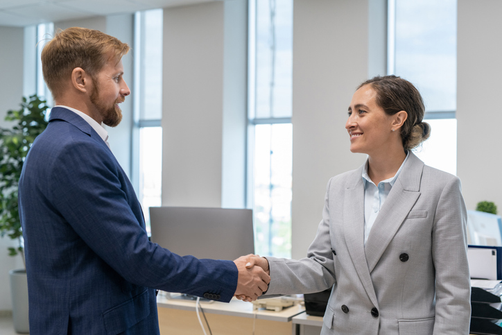 Man and woman shaking hands