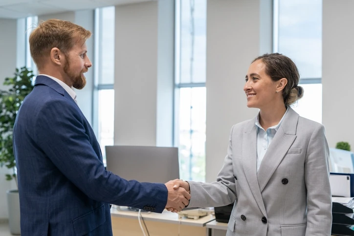 Man and woman shaking hands